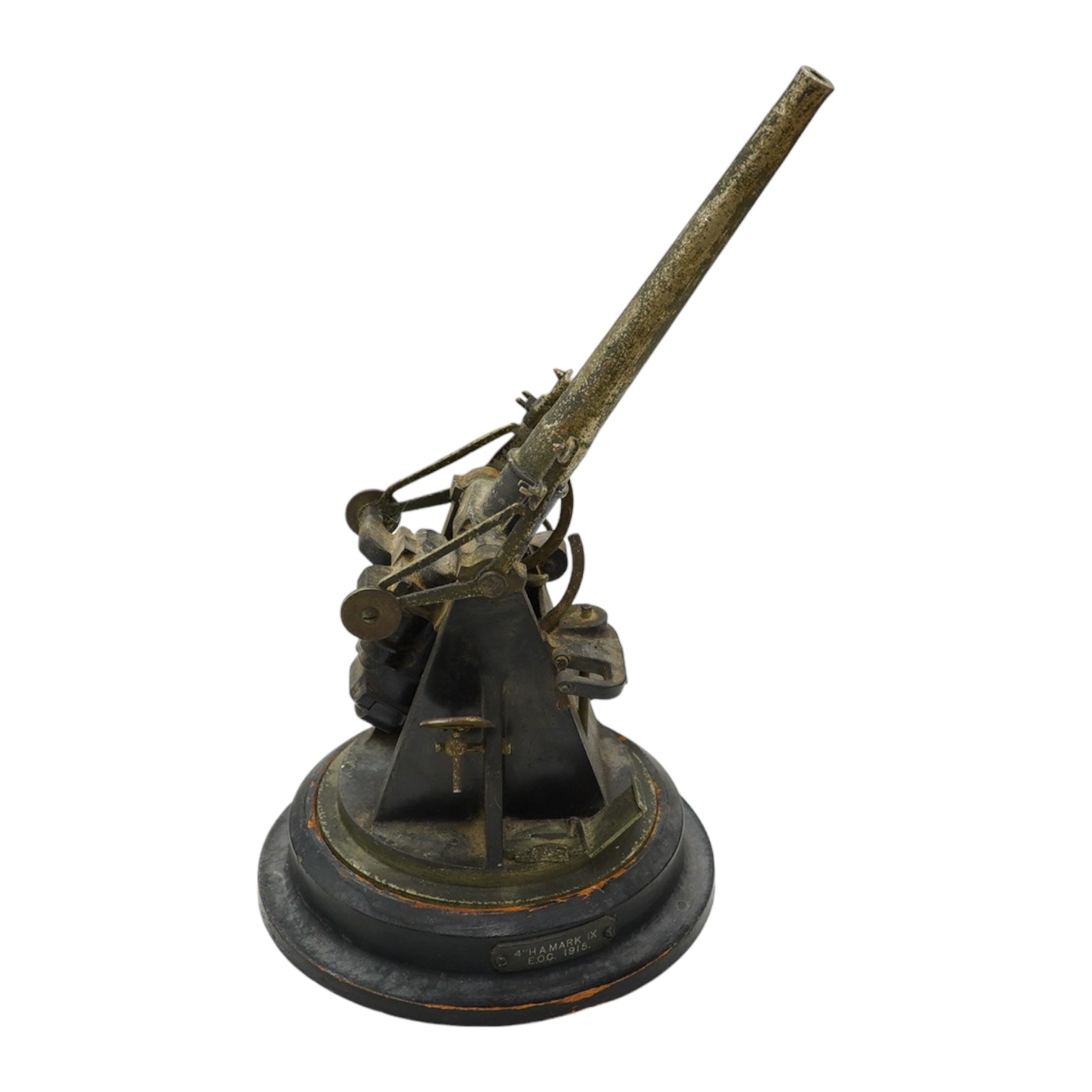 A steel model of a First World War 4 inch mark IX E.O.C. anti-aircraft gun, barrel 18cm, on a turned ebonised pine base with applied label. Condition - fair, some wear overall